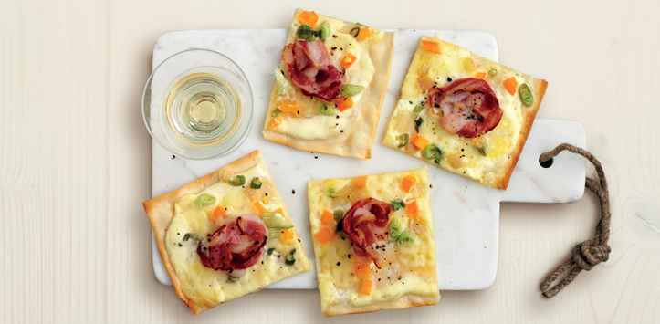 Flammkuchen (tarte flambée) with bacon and raclette