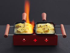 Raclette mit Ananas flambiert