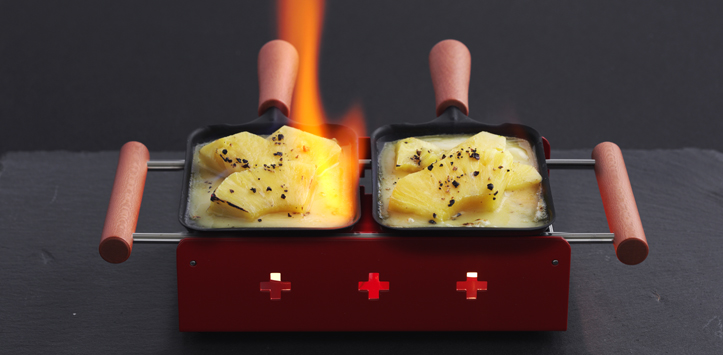 Raclette mit Ananas flambiert