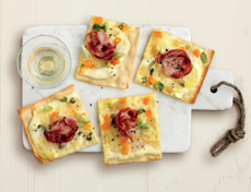 Flammkuchen (tarte flambée) with bacon and raclette