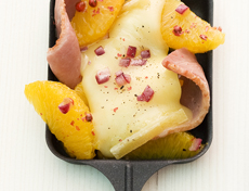 Raclette mit Entenbrust und Orangenfilets